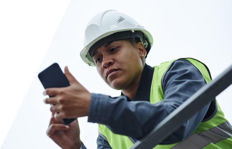 Roofers measuring a roof and generating a quote with roofing proposal software