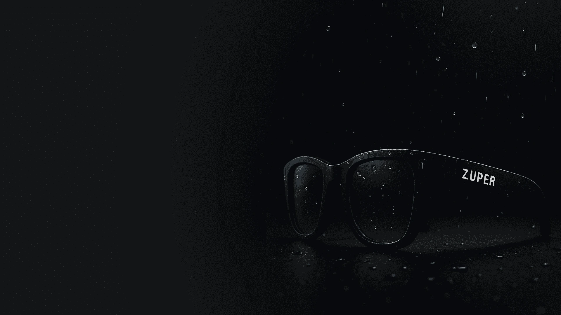 Zuper Glass with water droplets on the lenses, showing dust and water resistance